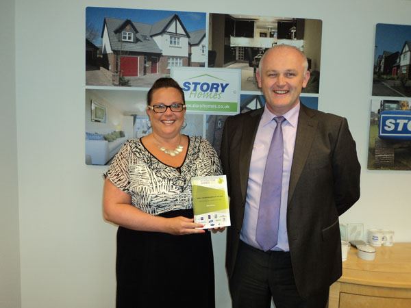 Louise McGuckin and Ian Sewell with the award