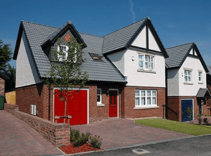 Family buys three new houses at development in Cumbria