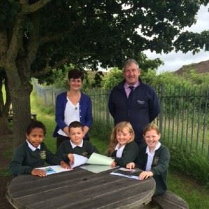 ian-kathy-and-kids-at-table-stood-up-600x600