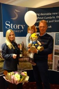 Neil Docherty  and his granddaughter celebrating the purchase