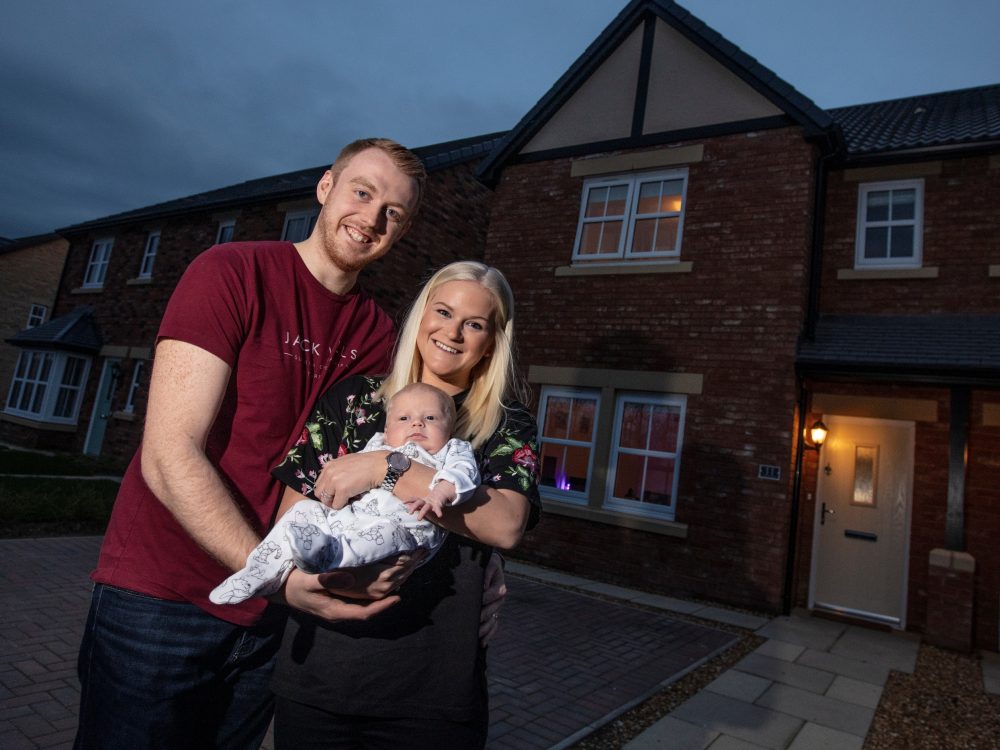 The Smiths Outside Their New Story Home