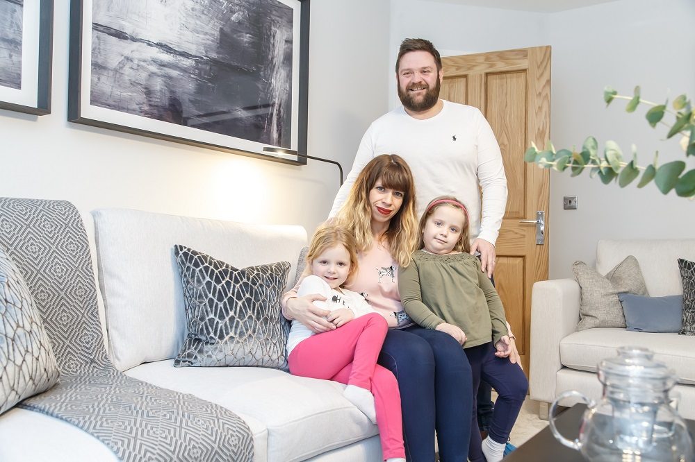 Roberts Family In Lounge Village