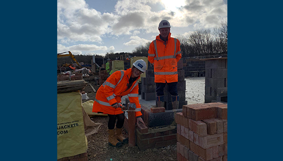 Amber and Peter lay first brick at St John’s Manor, Callerton
