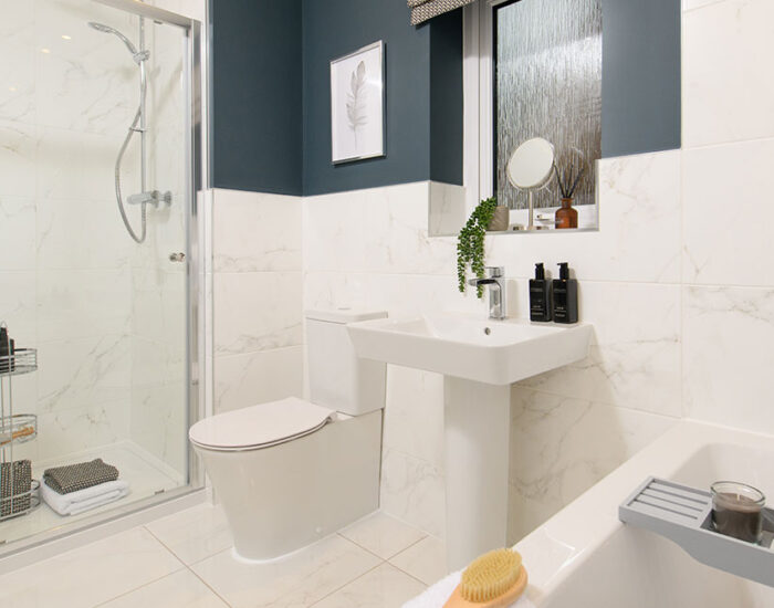 Porcelanosa tiles and rainfall shower to the spacious family bathroom