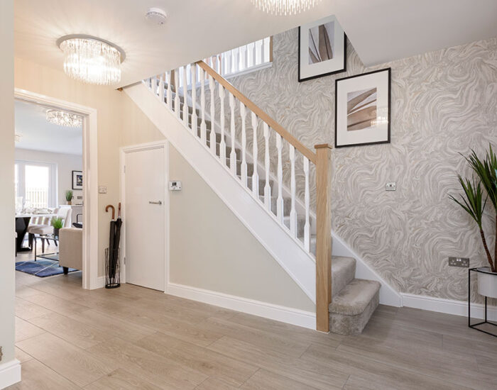 Large open plan hallway with feature oak staircase