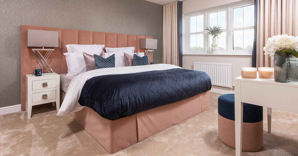 The main bedroom with en-suite in The Robinson show home at Whins View