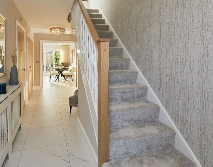 Large open plan hallway with feature oak staircase