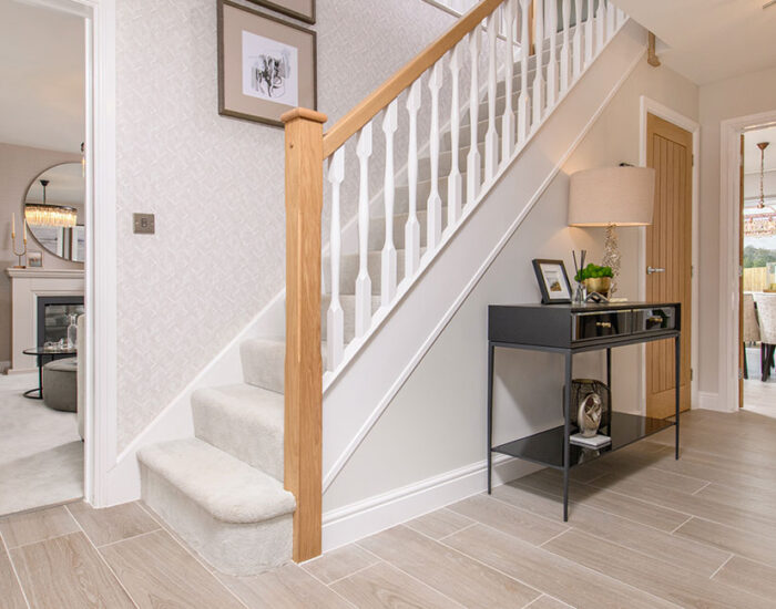 Large open plan hallway with feature staircase