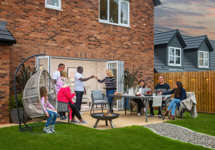 Customers enjoying the garden in their new Story home at Greystoke Fields