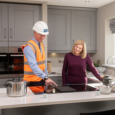 Home Demonstration With Site Manager And Customer In A Story Home