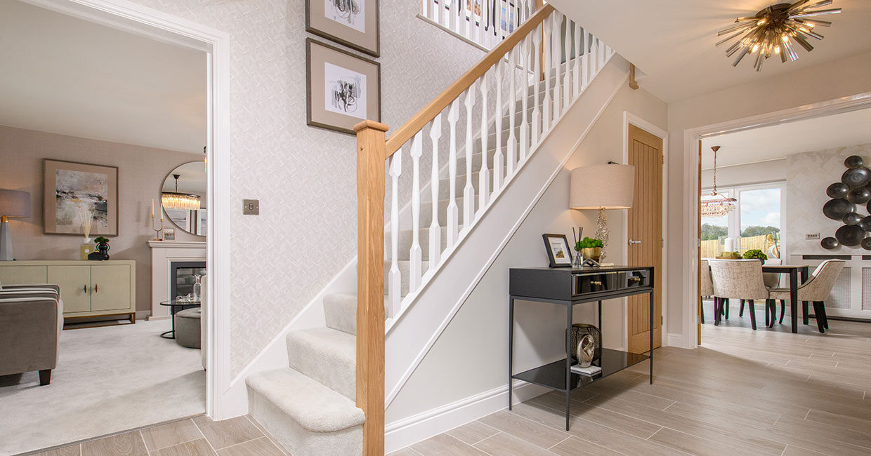 Spacious entrance hallways with feature oak staircase