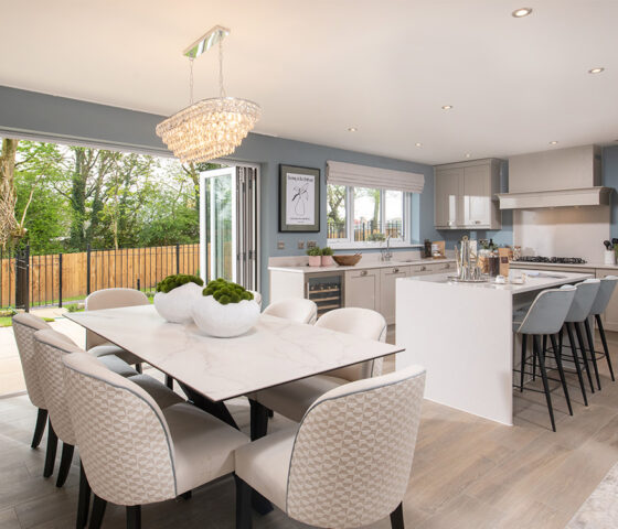 The kitchen/dining/family area in The Cranford show home at Brigsteer Rise | Story Homes