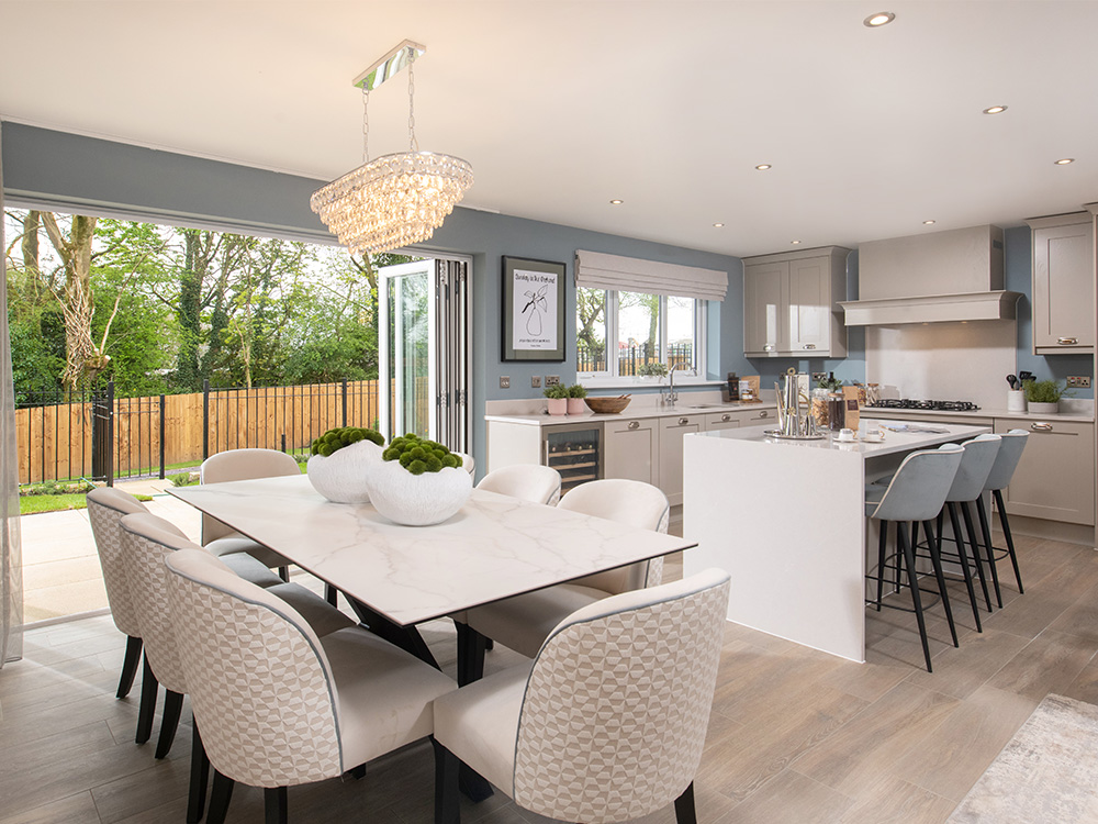 The kitchen/dining/family area in The Cranford show home at Brigsteer Rise | Story Homes