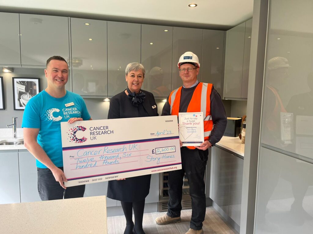 Story Homes presents cheque to Cancer Research UK