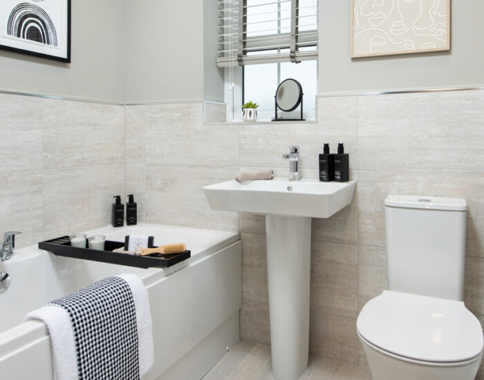 Double ended bath in bathroom and rainfall shower in the en-suite