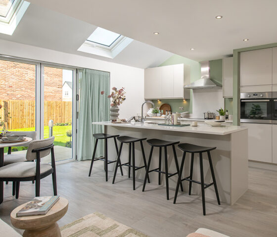 An open plan kitchen dining area in a Story Homes Dawson house type.