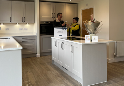 Image of customers in Cranford kitchen | Story Homes