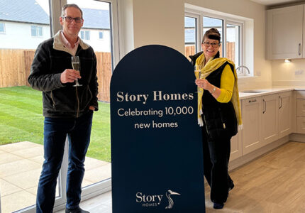 Image of customers in Cranford kitchen | Story Homes