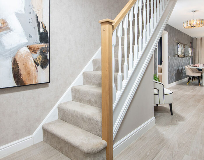 Large open plan hallway with feature oak staircase