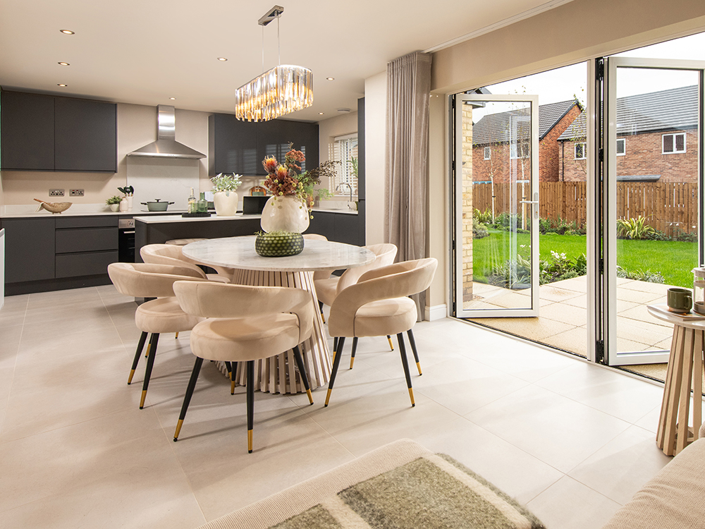 A view of a kitchen and dining area from a Sanderson show home at Ashwood Grange, by Story Homes.