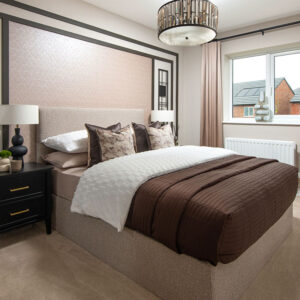 A view of the bedroom and a double bed in a Sanderson show home at Stonebrook Meadows at Story Homes.