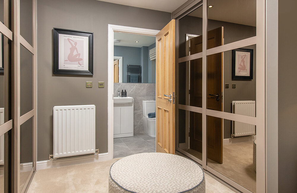 The dressing area in a main bedroom of a Charlton show home from Story Homes.