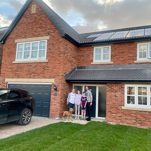 A shot of a family outside The Cranford at our Robinson Fields development.