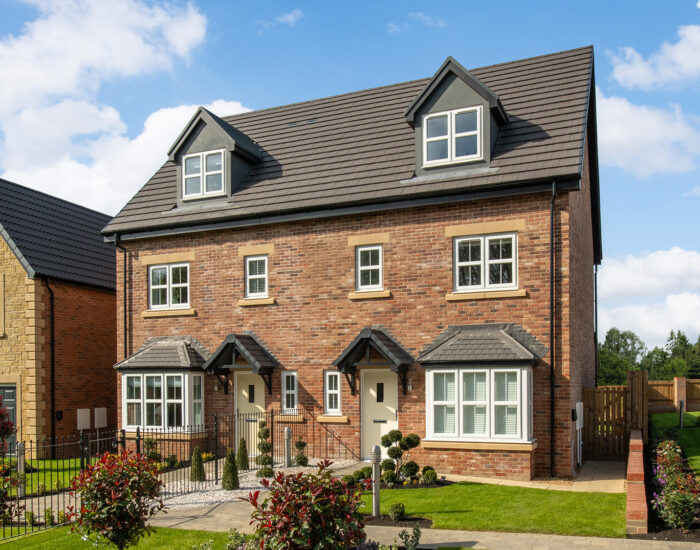 An external photo of a Story Homes Dawson show home at their Heritage Fields development.