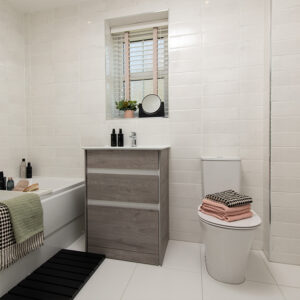 main bathroom with bath and toilet
