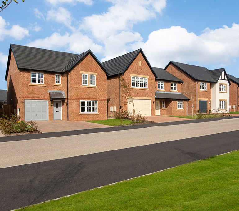 A street scene of new build houses at Tithe Gardens.