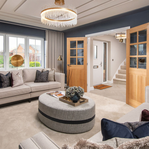 An image showing sofa and double doors in the lounge of the Lawson at Stonebrook Meadows