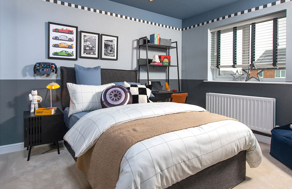 A view of a bedroom, including a double bed, in a Lawson show home at Stonebrook Meadows, by Story Homes.