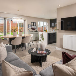A view of the Kitchen, dining and family area, in a Lawson show home at Stonebrook Meadows by Story Homes.