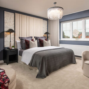 A view of the main bedroom, including a double bed, in a Lawson show home at Stonebrook Meadows by Story Homes.