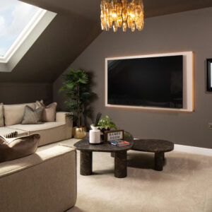 The Middleton attic room with sofas and tv