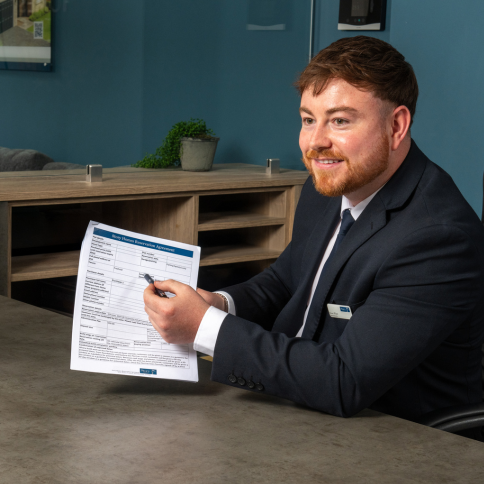 Sales Executive holding a reservation checklist