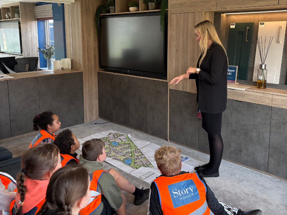 Story Homes Land team showing site plans to school children