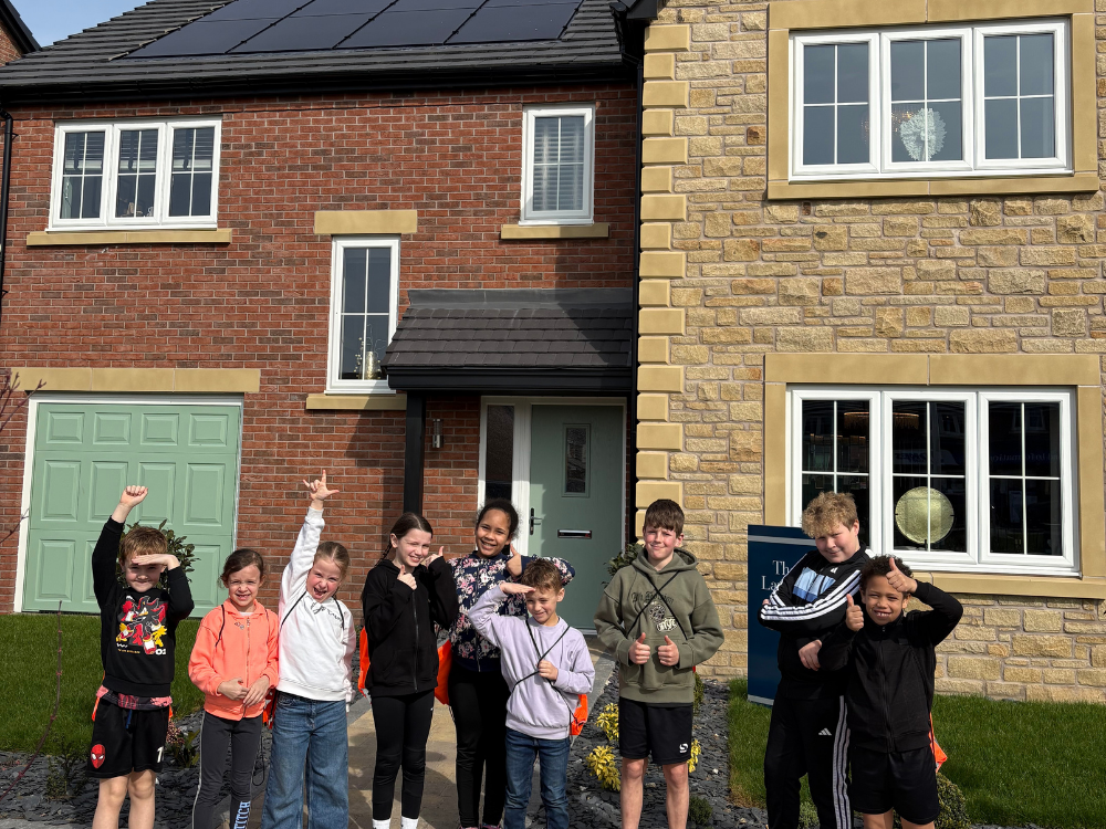 School children outside of 'The Lawson' show home at Stonebrook Meadows, Garstang