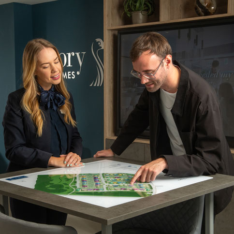 Sales Executive showing customer plots on the development