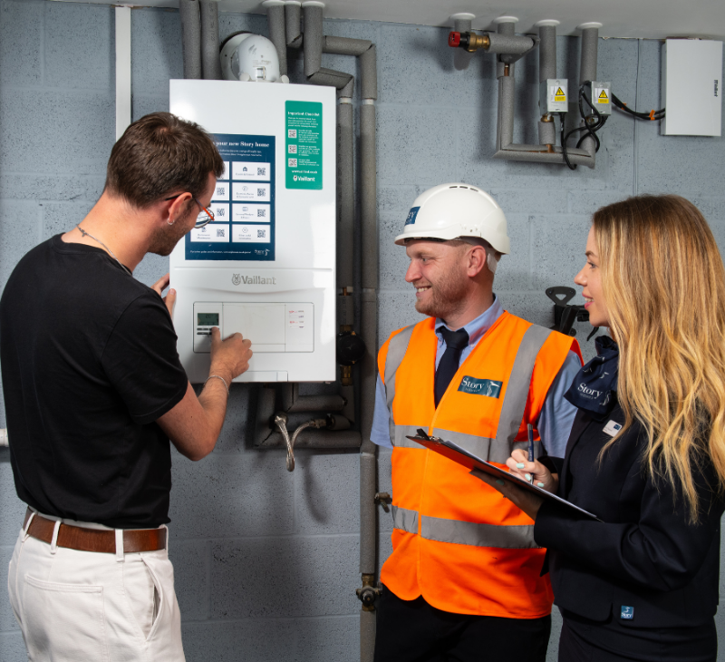 Site and Sales team showing customers the consumer unit/boiler