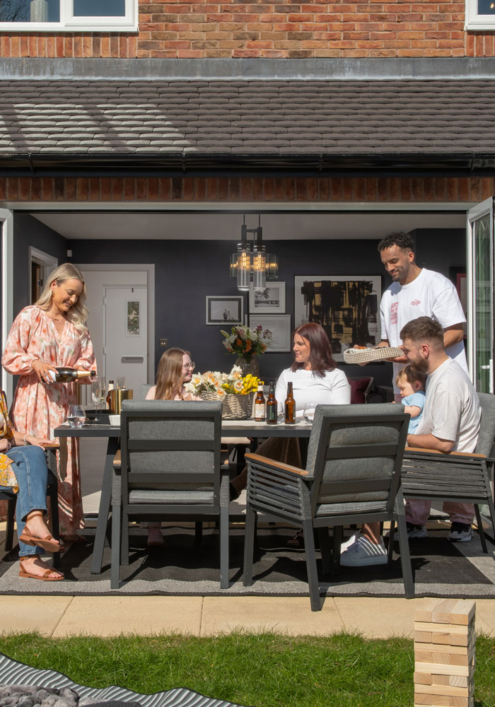 Family dining around a table outdoors