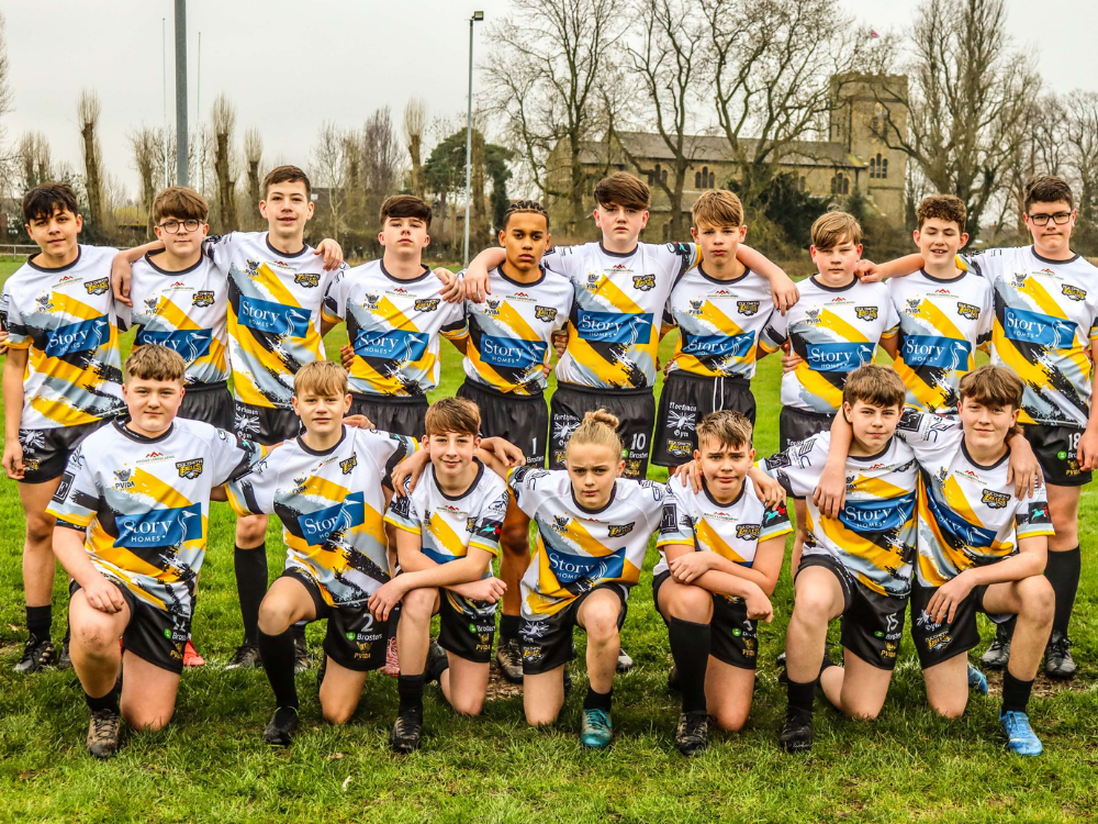 Culcheth Eagles U14's rugby club in branded Story Homes strips