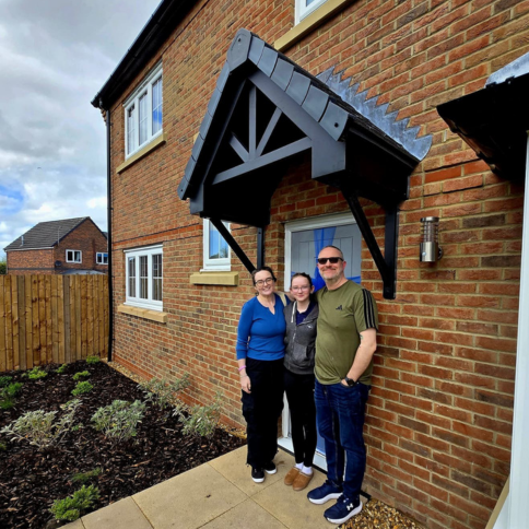 Customers standing outside their Wilson home