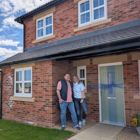 Tracey and Anth outside their Charlton home at Riverbrook Gardens